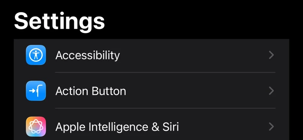 iPhone Settings, with Action Button between Accessibility and Apple Intelligence & Siri